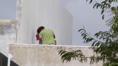 Men-working-on-a-rooftop-on-a-sunny-day