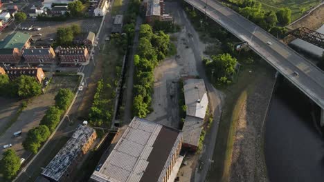 Drone-shot-over-warehouse-and-city-24fps