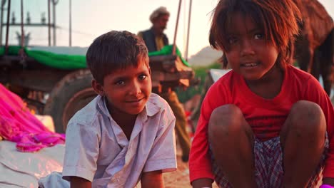 Brother---sister-of-rural-india-looking-at-each-other-in-slow-motion-at-pushkar-,-rajasthan-,-india