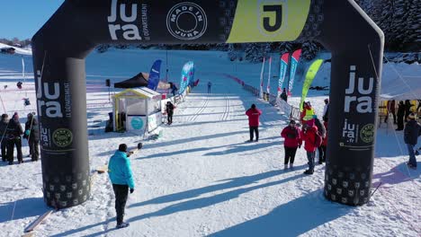 Aerial-shot-of-cross-country-athlete-reaching-finish-line,winning-race-during-sunny-day-in-France