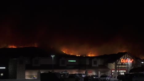 Granby-City-Market-with-massive-orange-forest-fire-on-hillside-beyond