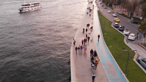 Back-sea-side-pedestrian-walkway-near-Rumeli-fortress,-Instabul