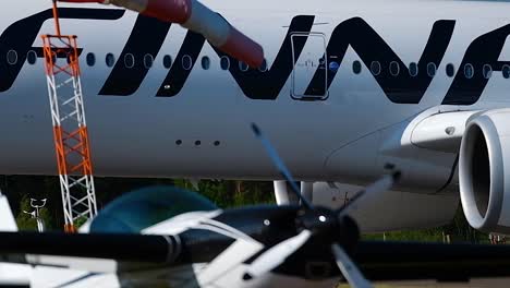 Airbus-A350-taking-off-in-sunny-afternoon---contrast-of-airliner-and-blue-sky