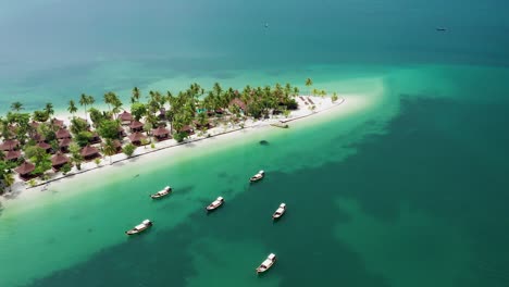 Aerial-of-Koh-Mook-Sivalai-Beach-Resort-with-longtail-boats,-Thailand