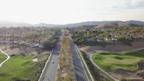 Suburban-road-in-fall-from-above