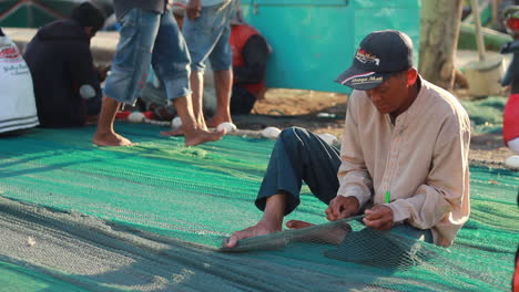 fishermen-are-repairing-nets-in-preparation-for-fishing-in-the-sea