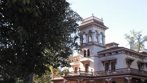 Camera-Tilts-down-on-the-Bidwell-Historic-Mansion-in-Chico,-CA-on-a-sunny-day-in-the-fall