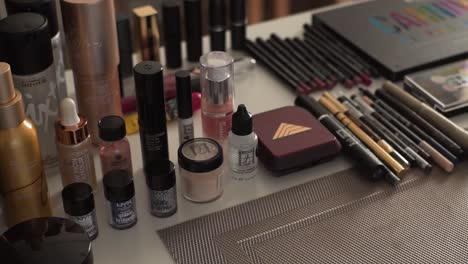 sliding-shot-of-the-makeup-equipment-in-the-make-up-artist's-work-place