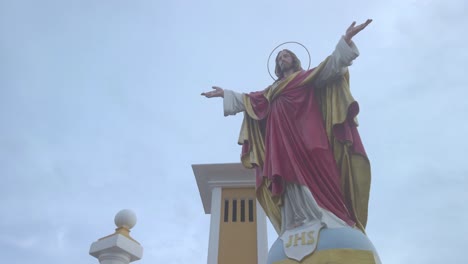 Looking-at-Jesus-with-a-church-in-the-background