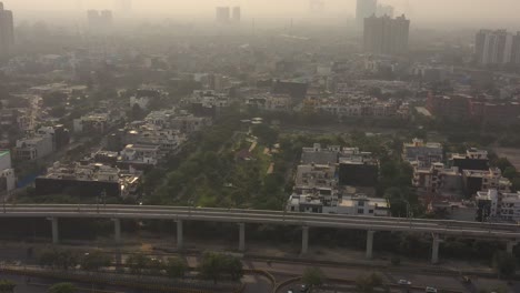 Aerial-Drone-Footage-Of-urban-City-buildings,-residential-houses-and-pollution-in-New-Delhi,-India-4k-UHD