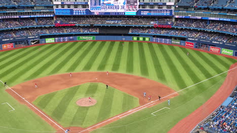 Ballpark-Baseball-Stadium-Stands-Bleachers-Panning-View,-Professional-Major-League-Match-Blue-Jays-Toronto-Club-Vs-Red-Sox,-Crowd-Spectators-Fans-in-Stands-Around-Green-Field