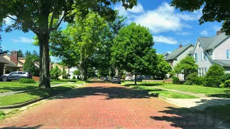 An-old,-beautiful-brick-road-in-Jamestown,-New-York,-USA,-during-summer-on-a-sunny-day