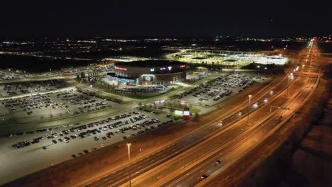 Aerial-night-time-video-of-Canadian-Tire-Centre-in-Ottawa-Ontario-Canada,-home-to-the-Ottawa-Senators-of-the-NHL