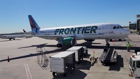 Frontier-airlines-airbus-A320-approaches-gate-at-ATL-in-Orville-the-cardinal-livery