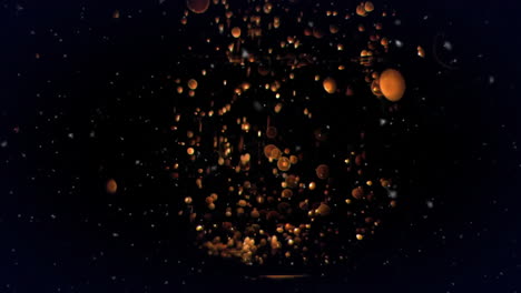 Animation-of-light-particles-and-orange-spheres-on-black-background