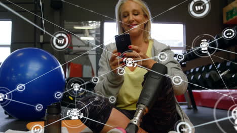 Animation-of-network-of-connections-with-graph-icons-over-caucasian-woman-using-smartphone