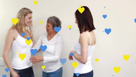 Animation-of-hearts-over-caucasian-women-smiling-and-embracing