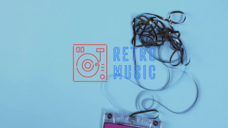 Animation-of-retro-music-text-with-icon-over-tape-on-blue-background