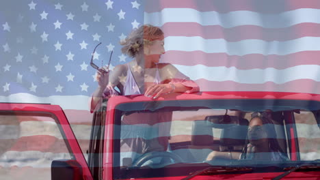 Animation-of-flag-of-usa-over-african-american-and-caucasian-female-friends-sitting-in-car