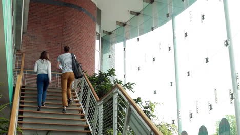 Friends-speaking-and-going-up-the-stairs