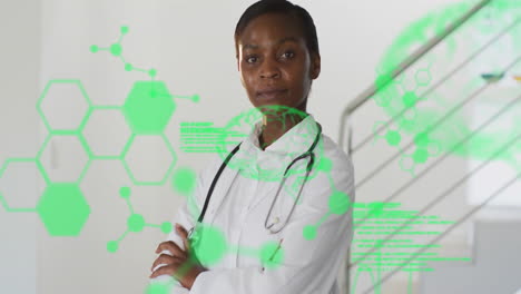 Animation-of-green-medical-data-processing-over-african-american-female-doctor-smiling-at-hospital