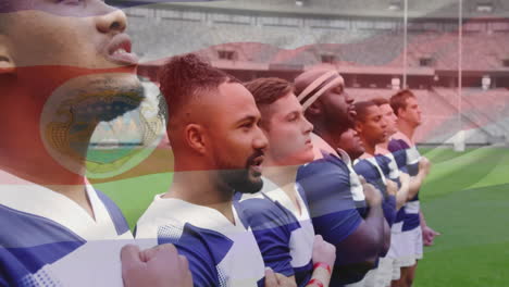 Animation-Der-Flagge-Von-Costa-Rica-über-Einem-Vielfältigen-Männlichen-Rugby-Team,-Das-Vor-Dem-Spiel-Auf-Dem-Spielfeld-Singt