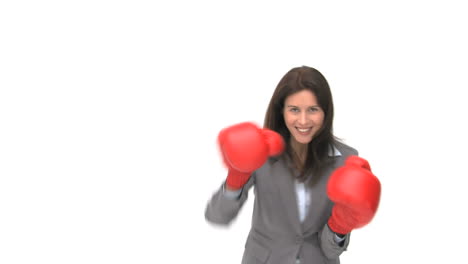 Smiling-businesswoman-with-boxing-gloves-