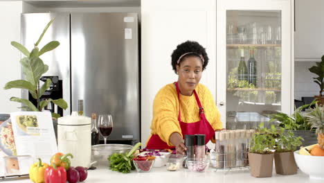 Play-back-cookery-show-of-an-African-American-woman-preparing-food-in-a-modern-kitchen