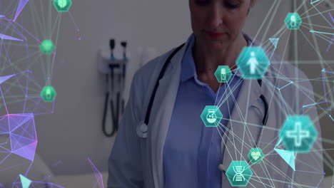 Animation-of-network-of-connections-with-icons-over-caucasian-female-doctor-using-tablet