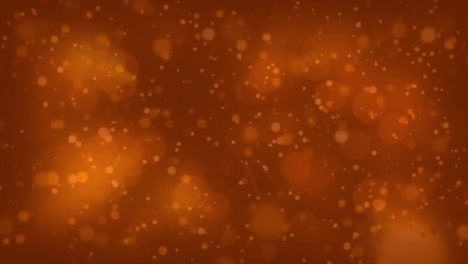 Animation-of-glowing-light-spots-moving-over-orange-background