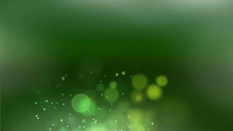 Animation-of-glowing-light-spots-moving-over-green-background