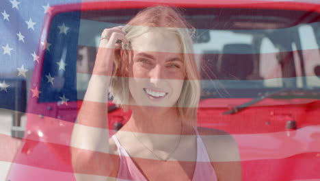 Animation-of-flag-of-usa-over-caucasian-woman-by-car-on-beach