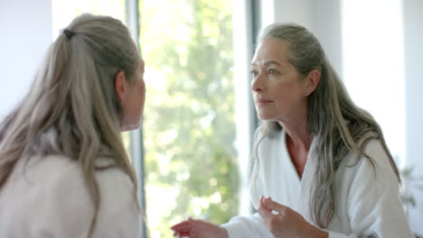 Caucasian-mature-woman-with-long-gray-hair-talking-to-someone