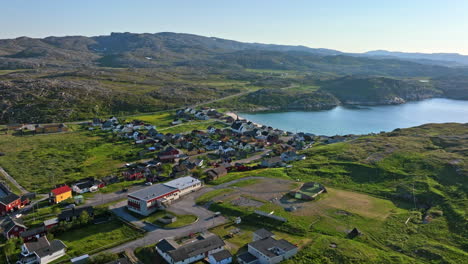 Aerial-view-toward-the-town-center-of-Bygones,-summer-evening-in-Pykeija,-Norway