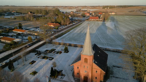 Aerial-of-church-at-sunset-in-winter