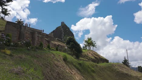 Stunning-view-of-El-Peñón-de-Guatapé-with-lush-greenery-and-blue-sky