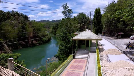 Philippines,-Bohol:-The-video-captures-an-aerial-view-of-the-Loboc-River-and-the-dense-forest-surrounding-it,-showcasing-the-lush-landscape