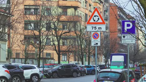 Traffic-signs-on-a-typical-street-in-Milan,-Italy