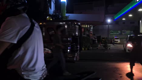 Night-Traffic-in-Downtown-Manila,-Philippines,-Motorbikes-and-Jeepney-Vehicles,-Passenger-POV