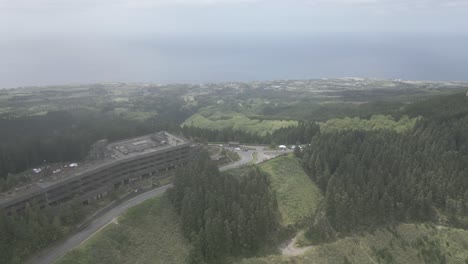 Lush-green-landscape-of-Sete-Cidades,-Portugal,-captured-from-above-with-coastal-view