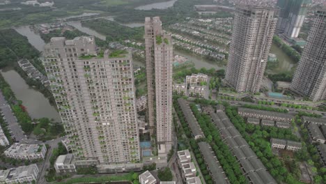 Aerial-view-of-high-rise-buildings-and-lush-green-residential-areas-in-Hanoi,-Vietnam