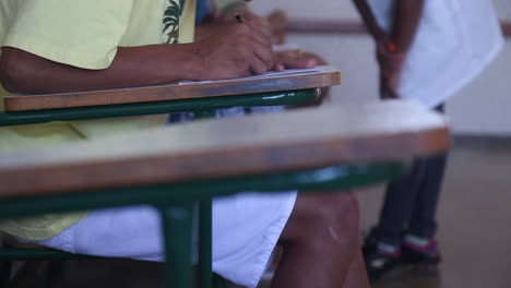 Man-writing-a-letter-sitting-on-a-chair