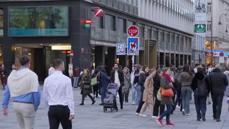 People-walking-through-pedestrian-streets-in-the-center-of-Vienna,-Austria