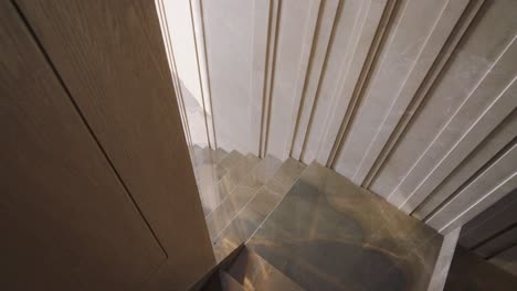 Marble-Staircase-With-A-Gold-And-White-Stripe-Pattern-Design