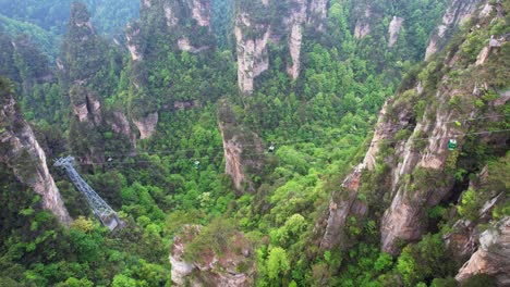 Aerial-view-over-Huangshizhai-cable-car-in-Zhangjiajie-National-Forest-Park,-China