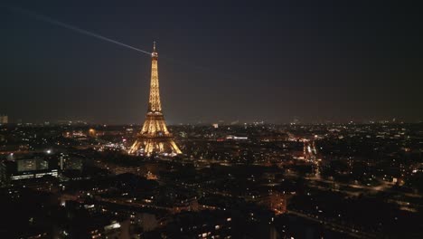 Tour-Eiffel-Tower-illuminated-at-night-with-light-show-from-top,-Paris,-France