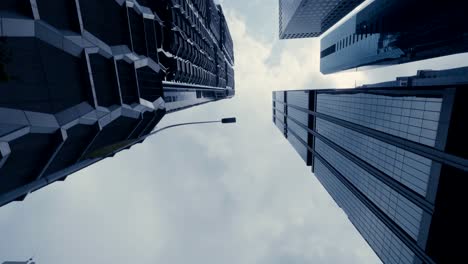 Stunning-time-lapse-driving-through-high-rise-office-buildings-looking-up-at-the-sky