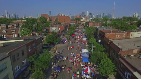 Taste-of-Italy-Along-College-Street-in-Toronto-with-Overhead-Dolly-Shot,-Canada