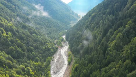 Aerial-Drone-Fly-Green-Mountain-Valley-River-at-Spurga-Locarno-Swiss-Landscape