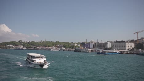 Ships,-ferries,-boats,-historical-buildings-in-the-Bosphorus,-Istanbul,-Turkiye